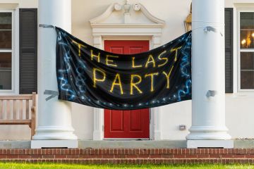 The Last Party banner hangs between the front columns of a fraternity house. To illustrate hazing at universities in the USA. The Last Party banner hangs between the front columns of a fraternity house. To illustrate hazing at universities in the USA.