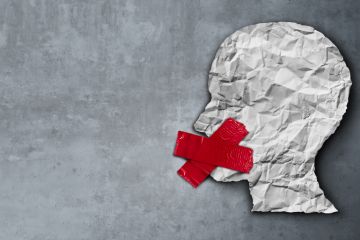 A head with an X over the mouth