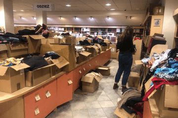 A woman sorts through donations for Ukraine at the University of Gdansk