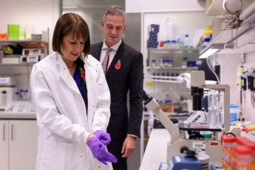 Britain's Chancellor of the Exchequer Rachel Reeves puts on gloves, as she and Britain's Secretary of State for Science, Innovation and Technology Peter Kyle visit the Cambridge Biomedical Campus Britain's Chancellor of the Exchequer Rachel Reeves puts on gloves, as she and Britain's Secretary of State for Science, Innovation and Technology Peter Kyle visit the Cambridge Biomedical Campus