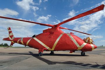 Gift-wrapped helicopter on launch pad Gift-wrapped helicopter on launch pad