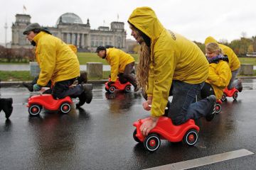 Greenpeace activists protesting, Reichstag building, Berlin