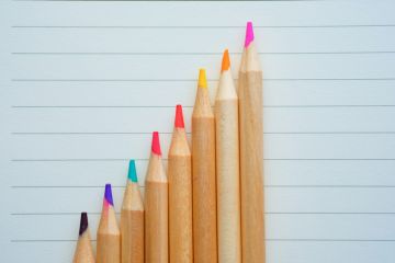 growth graph with pencils on paper