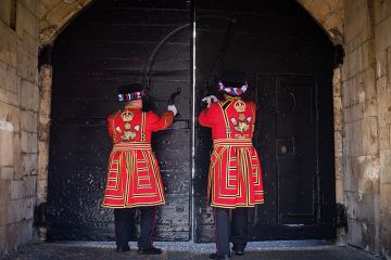 Two Yeoman Warders closing doors Two Yeoman Warders closing doors to illustrate whether Labour want more people to go to university