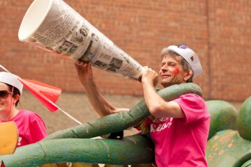 Halifax, Nova Scotia, Canada - July 23, 2011 A man dressed in a sailor's outfit yells and smiles to the crowds in the 24th annual Pride Parade through the heart of the city. Halifax has the fourth largest Pride Parade in Canada and is renowned for its fam