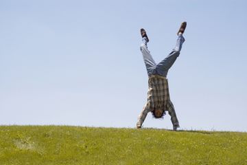 Student doing handstand Student handstand on grass