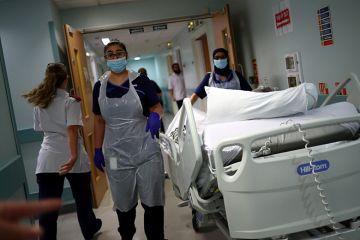 Medical staff transfer a patient through a corridor at The Royal Blackburn Teaching Hospital in East Lancashire. To illustrate that the UK’s incoming tax on international student fees could have unintended consequences for country’s health system. Medical staff transfer a patient through a corridor at The Royal Blackburn Teaching Hospital in East Lancashire. To illustrate that the UK’s incoming tax on international student fees could have unintended consequences for country’s health system.
