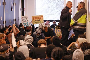Boston University Police officers conferred with each other as students protested demanding that BU declare itself a sanctuary campus to protect students from the Federal government regardless of their immigration status, 3 April 2025 Boston University Police officers conferred with each other as students protested demanding that BU declare itself a sanctuary campus to protect students from the Federal government regardless of their immigration status, 3 April 2025