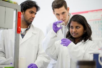 Indian scientists perform an experiment