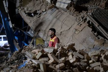 An Iranian firefighter in the ruins of a collapsed building in Tehran on March 11, 2025 An Iranian firefighter in the ruins of a collapsed building in Tehran on March 11, 2025