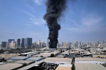 A black plume of smoke rises from a warehouse at the industrial area of Sharjah City in the United Arab Emirates following reports of Iranian strikes in Dubai, United Arab Emirates, Sunday, 1 March, 2026. A black plume of smoke rises from a warehouse at the industrial area of Sharjah City in the United Arab Emirates following reports of Iranian strikes in Dubai, United Arab Emirates, Sunday, 1 March, 2026.
