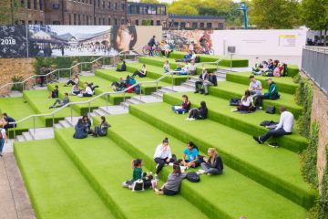 Young People students sitting outdoor on Granary Square steps Young People students sitting outdoor on Granary Square steps.