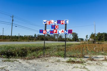 Sign reading 'Welcome to Trumpland'