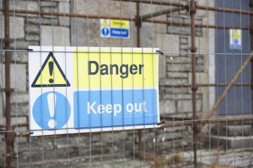 "Danger - keep out" sign on construction site