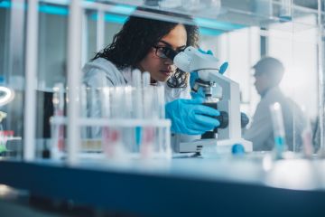 Biotechnology specialist working with advanced equipment Biotechnology specialist working with advanced equipment