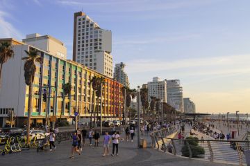 Dan Tel Aviv hotel and Tel Aviv promenade in the evening Dan Tel Aviv hotel and Tel Aviv promenade in the evening