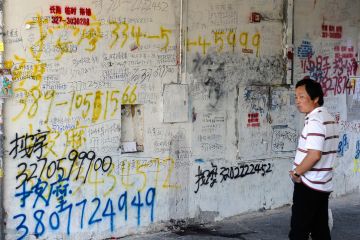Ads in chinese language written on the walls, in the area of via Pistoiese, the heart of Prato's Chinatown.