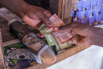 Scene with payment of money in a shop Scene with payment of money in a shop