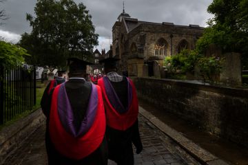 Canterbury Christchurch BAME Graduates process along wet Rochester streets in the rain following the graduation ceremony. Canterbury Christchurch BAME Graduates process along wet Rochester streets in the rain following the graduation ceremony.