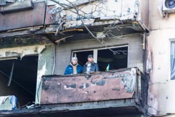 Damage to an apartment building in Kyiv, an explosion due to a hit by a military shell.