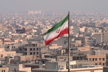 Iranian flag flying in wind Iranian flag flying in wind