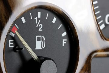 Fuel gauge on car dashboard - almost empty