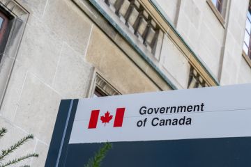 Government of Canada sign outside the office building in Ottawa, Ontario, Canada. Government of Canada sign outside the office building in Ottawa, Ontario, Canada.