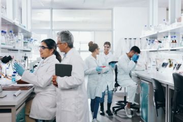 Scientists in a laboratory researching for a clinical trial 