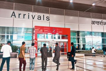 People waiting at arrival at Delhi IGI IndiaAirport, India People waiting at arrival at Delhi IGI IndiaAirport, India