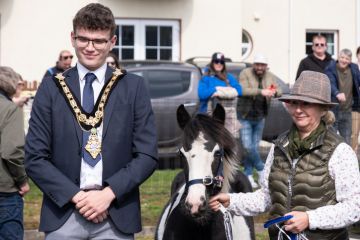 Councillor Ciarán McQuillan Mayor of Causeway Coast and Glens poses with female competitor in annual Lammas Fair Heavy Horse show.