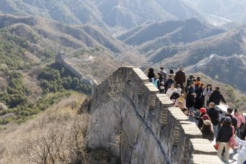 The Great Wall in Badaling with lots of visitors on a sunny day in autumn. The Great Wall in Badaling with lots of visitors on a sunny day in autumn.