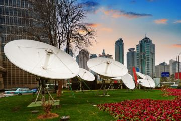 Shanghai's skyscrapers and satellite antenna. Shanghai's skyscrapers and satellite antenna.