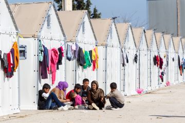 Refugees living in tents Refugees living in tents