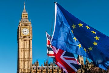 European Union and UK flags in front of Big Ben, Brexit EU European Union and UK flags in front of Big Ben, Brexit EU