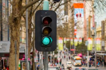 Traffic Light showing green in downtown Melbourne, Australia