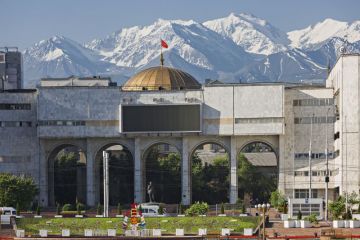 View over the city centre of Bishkek with snow capped mountains in the background. View over the city centre of Bishkek with snow capped mountains in the background.