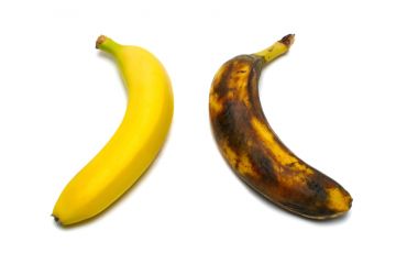 Two bananas: one yellow, one brown Two bananas: one yellow, one brown
