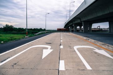 U-turn sign painted on road