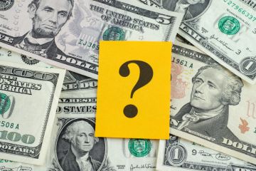 Question mark over dollar bills