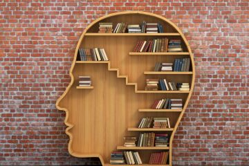 Books on head-shaped shelving