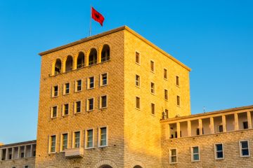 The Albanian flag flies above the Polytechnic University of Tirana