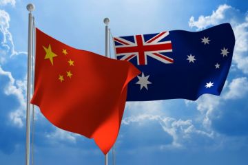 Chinese and Australian flags flying Chinese and Australian flags flying
