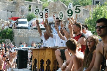 Judges scoring bridge jumping contest, Mostar, Bosnia Judges scoring bridge jumping contest, Mostar, Bosnia