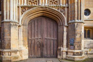 The closed gate of King's College, Cambridge, symbolising university access