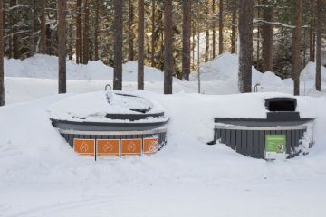 Kittila, Finland - Feb 23, 2020 Finland public trash covered by snow.