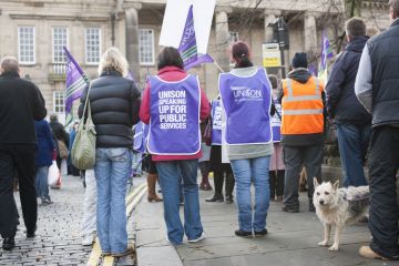 Lancaster, UK - November 30, 2011 Crowd of people outside Lancaster Town hall protesting the proposed changes to the public sector Pension plan and ongoing Government spending cuts.