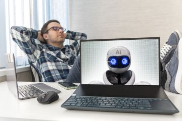 A human rest next to a computer with AI on its screen A human rest next to a computer with AI on its screen