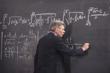 Lecturer in front of blackboard