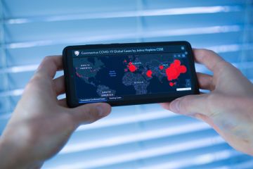 London, United Kingdom - February 27, 2020 2019 Coronavirus COVID-19 Global Cases by Johns Hopkins CSSE Situation Summary on Mobile Phone Display.