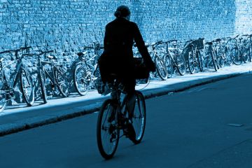 Male cyclist riding bike, Trinity Lane, Cambridge Male cyclist riding bike, Trinity Lane, Cambridge